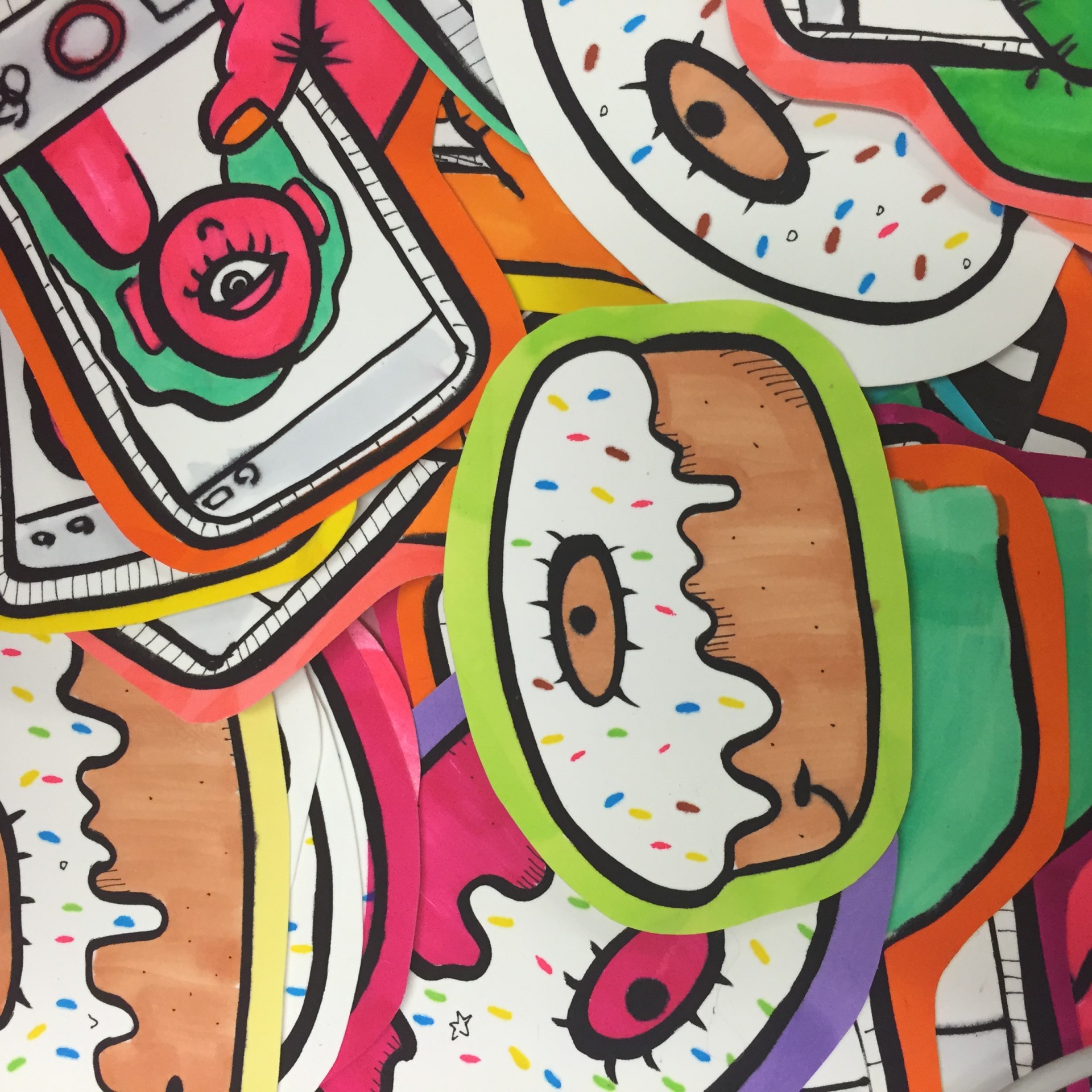 Pile of doughnut shaped stickers. 