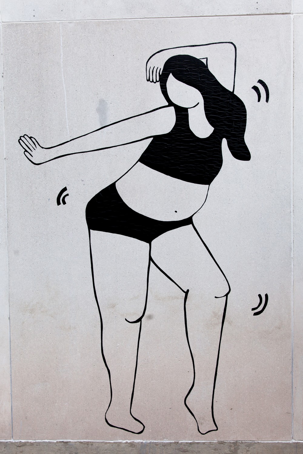 Image of single woman in mural dancing in underwear. 
